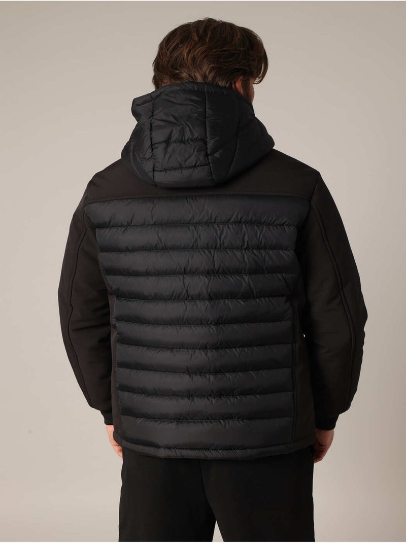 Veste matelassée avec capuche et poches zippées
 'Deeluxe' Noir - Kiabi