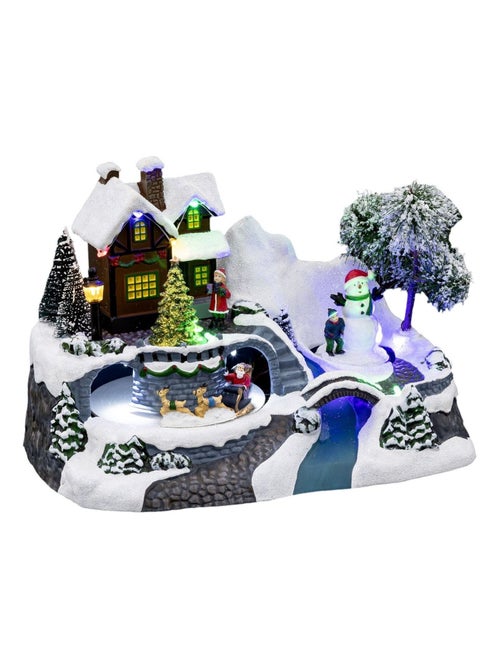 Village de Noël enneigé avec le Père Noël en traineau - Kiabi