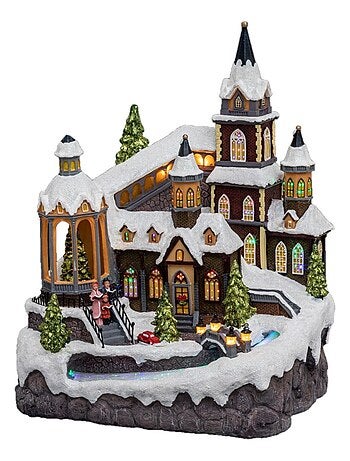 Village de Noël lumineux avec rivière