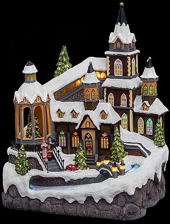 Village de Noël lumineux avec rivière